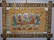 This leather painting depicts Ethiopian Orthodox priests playing sistra and a drum.