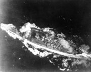 Yamato hit by a bomb near her forward gun turret in the Sibuyan Sea.