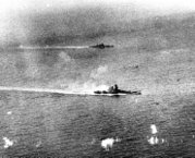 The Yamato and a heavy cruiser, possibly Tone or Chikuma, in action off Samar.