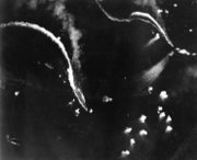 The Japanese aircraft carriers Zuikaku, left, and (probably) Zuihō come under attack by dive bombers early in the battle off Cape Engaño.