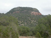 Reddish Moenkopi outcrop below volcanic rubble on Red Butte
