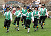 Morris dancing in the grounds of Wells Cathedral, Wells, England - Exeter Morris Men