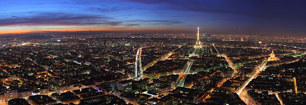 Panoramic view over Paris, at dusk, from the top of the Tour Montparnasse.