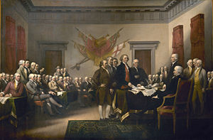 John Trumbull's famous painting depicts the five-man drafting committee presenting their work to the Congress. John Adams is standing in the center of the painting.