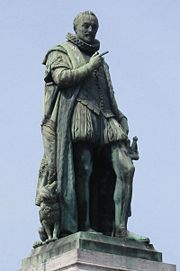 A statue of William of Orange in The Hague. His finger originally pointed towards the Binnenhof, but the statue has since been moved. A similar statue stands in Voorhees Mall on the campus of Rutgers University.