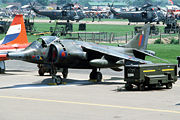 A Royal Air Force Harrier GR. Mark 3 aircraft parked on the flight line during Air Fete '84 at RAF Mildenhall.