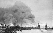 View of smoke rising from St Katharine Docks after the first raid of the Blitz on 7th September.