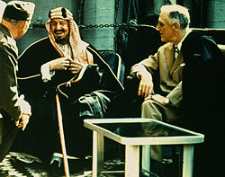 The founder of modern Saudi Arabia, King Abdul Aziz, converses with U.S. President Franklin Delano Roosevelt on board a ship returning from the Yalta Conference in 1945