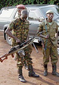 A Congolese soldier with a PK machine gun near the Rwandan border, 2001