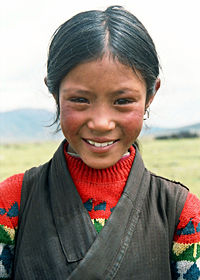 A young Tibetan girl in a valley in the Kham region of Tibet.
