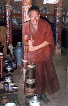 A monk churning Butter tea