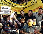 Members of the Kefaya democracy movement protesting a fifth term for President Hosni Mubarak. See also video.