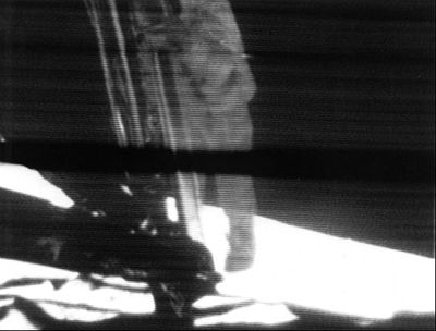 Still frame from the video transmission of Neil Armstrong stepping onto the surface of the Moon on 20 July 1969. An estimated 500 million people worldwide watched this event live, the largest television audience for a live broadcast at that time.