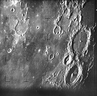 First image of the Moon taken by a US spacecraft, Ranger 7. The large crater at center right is Alphonsus