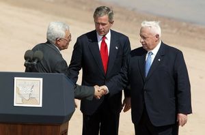 Abbas, President of the United States George W. Bush, and then-Israeli Prime Minister Ariel Sharon at the Red Sea Summit in Aqaba, Jordan on June 4, 2003.