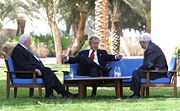 Bush, center, discusses the Middle East peace process with Sharon and Abbas in Aqaba, Jordan, June 4, 2003.