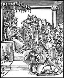 Antichristus, by the Lutheran Lucas Cranach the Elder. This woodcut of the traditional practice of kissing the Pope's toe is from Passionary of the Christ and Antichrist. The two fingers the Pope is holding up symbolizes his claim to be the Church's substitute for Christ's earthly presence.