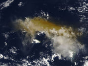 Satellite view of Mount Karthala after a Nov. 2005 eruption. Ash obscures the islands (outlined).
