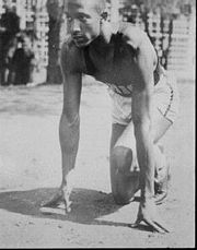 Jesse Owens on running track.