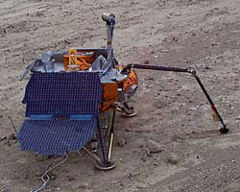 A prototype of the Phoenix lander practices robotic arm control at a test site in Death Valley.