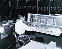 A meteorologist at the console of the IBM 7090 in the Joint Numerical Weather Prediction Unit. c. 1965