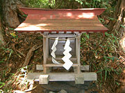 Typical Shinto shrine with paper streamers made out of unprocessed hemp fibre