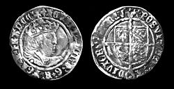 Silver groat of Henry VIII, minted c. 1540. The reverse depicts the quartered arms of England and France