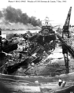 USS Pennsylvania, behind the wreckage of the USS Downes and USS Cassin.