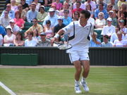 Henman backhand volleying at Wimbledon, 2004