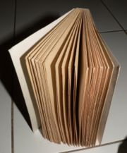 An uncut book after bookbinding from folded papers. The pages must be separated before reading.