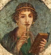 Woman holding a book (or wax tablets) in the form of the codex. Wall painting from Pompeii, before 79 AD.