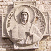 Carving of St. Benedict of Nursia, holding an abbot's crozier and his Rule for Monasteries (Münsterschwarzach, Germany).