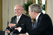 John Howard and U.S. President George W. Bush during a joint press conference in the East Room of the White House in May 2006.