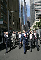 John Howard and U.S. President George W. Bush wave to the public in a Sydney street after leaving the Commonwealth Parliament Offices and walking to the InterContinental Hotel at APEC in September 2007