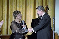 Fitzgerald shakes hands with President Ronald Reagan after performing in the White House, 1981