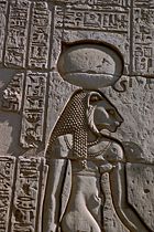 The warrior goddess Sekhmet, shown with her sun disk and cobra crown