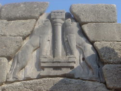 The Lion Gate of Mycenae (detail)—two lionesses flank the central column that represents a goddess—c. 1300 BC renovation of an existing structure that was demolished to build the new