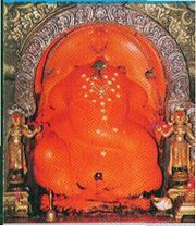 Ganesha as 'Shri Mayureshwar' with consorts Buddhi and Siddhi, Morgaon (the central shrine for the regional aṣṭavināyaka complex)