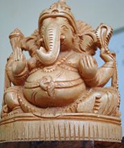 A statue of Ganesha carved in wood