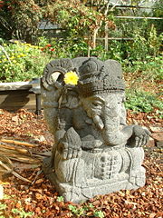 Statue of Ganesha with a flower