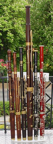 A collection of historical bassoons, from early baroque to modern, including a classical contrabassoon.