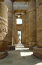 Karnak temple's hypostyle halls are constructed with rows of thick columns supporting the roof beams.