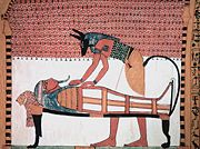 Anubis was the ancient Egyptian god associated with mummification and burial rituals; here, he attends to a mummy.