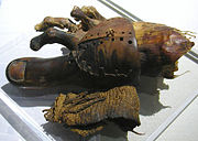 This wood and leather prosthetic toe was used by an amputee to facilitate walking.