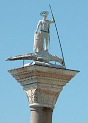 A statue of Saint Theodore of Amasea treading on a crocodile (Venice, Italy)