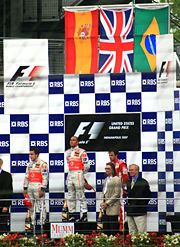 Hamilton on the podium after winning the 2007 United States Grand Prix