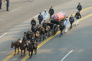 Ronald Reagan's casket, on a horse-drawn caisson, being pulled down Constitution Avenue to the Capitol Building