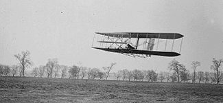 Orville in flight over Huffman Prairie in Wright Flyer II. Flight #85, approximately 1,760 feet (536 m) in 40 1/5 seconds, 16 November 1904.