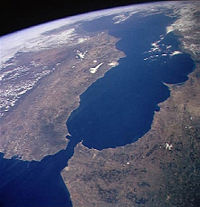 A satellite image taken from the side of the Strait of Gibraltar. At left, Europe: at right, Africa.
