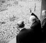 Churchill waves to crowds in Whitehall on the day he broadcast to the nation that the war with Germany had been won, 8 May 1945.